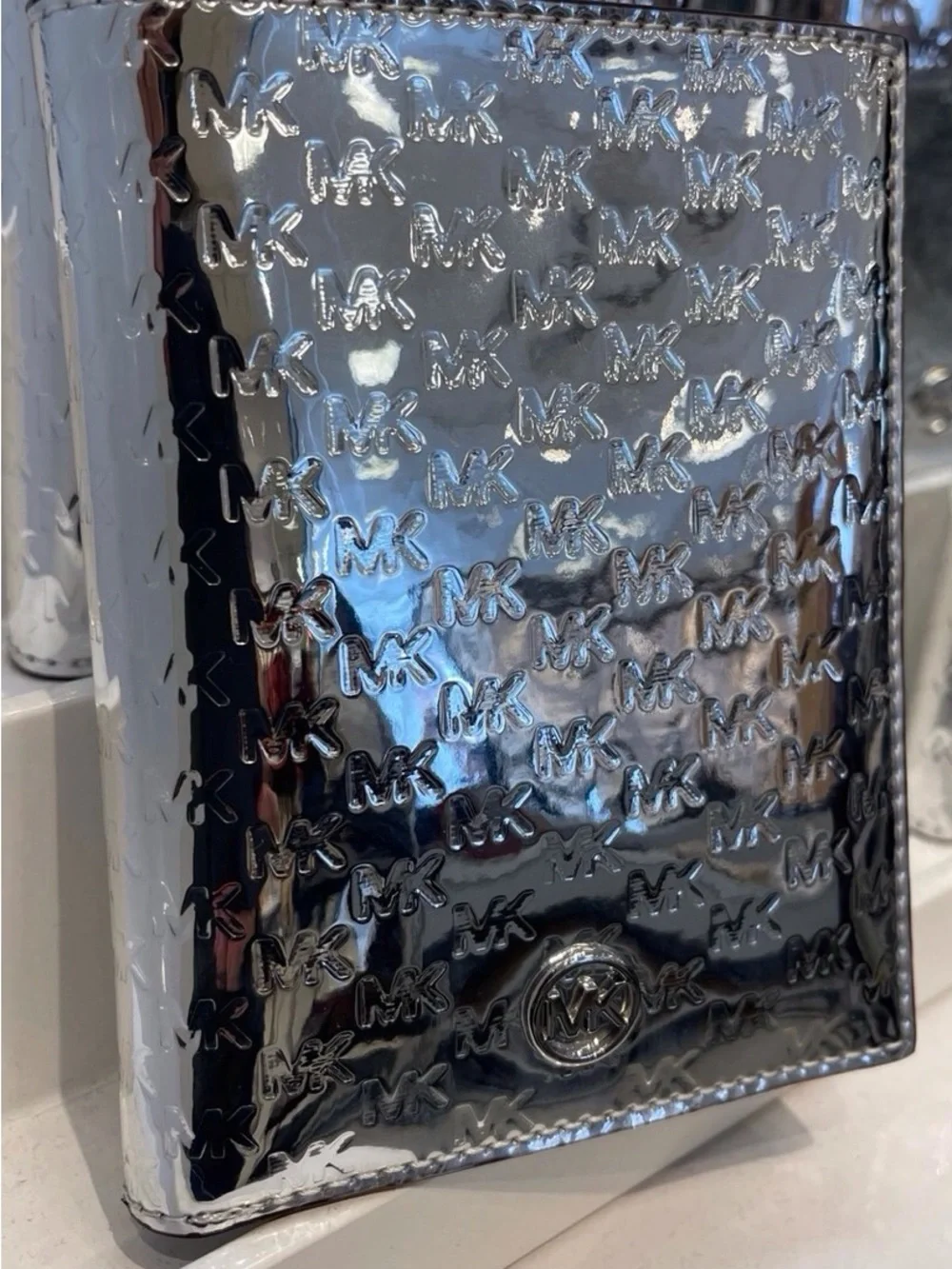 Michael Kors Metallic Silver Embossed MK Passport Cover